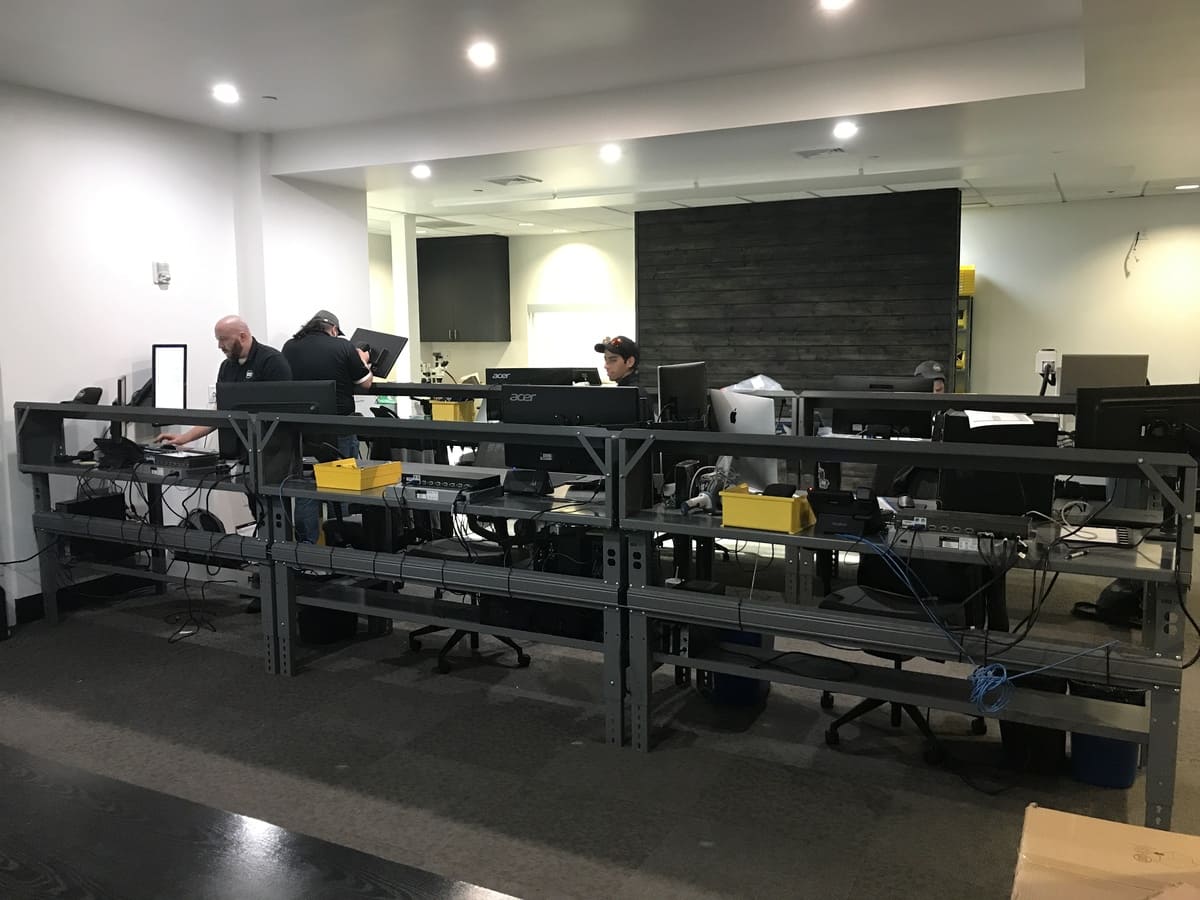 computer equipment on desks being setup